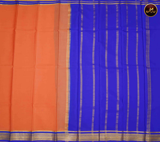 Mysore crepe silk saree with KSIC Finish in Peach and KSIC Blue combination with gold zari border and chit pallu