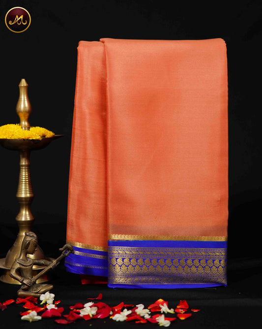 Mysore crepe silk saree with KSIC Finish in Peach and KSIC Blue combination with gold zari border and chit pallu