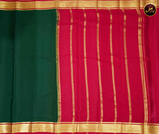 Mysore crepe silk saree with KSIC Finish in Bottle Green and Rani Pink combination with gold zari border and chit pallu