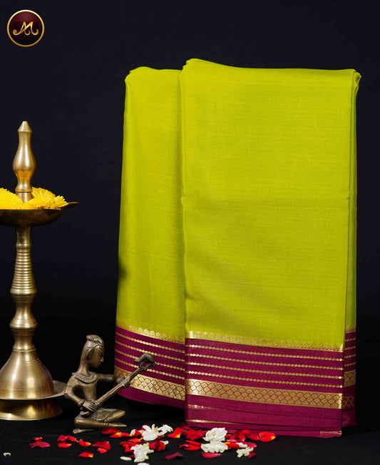 Mysore crepe silk saree with KSIC Finish  in Parrot Green with Magenta combination with gold zari border and chit pallu