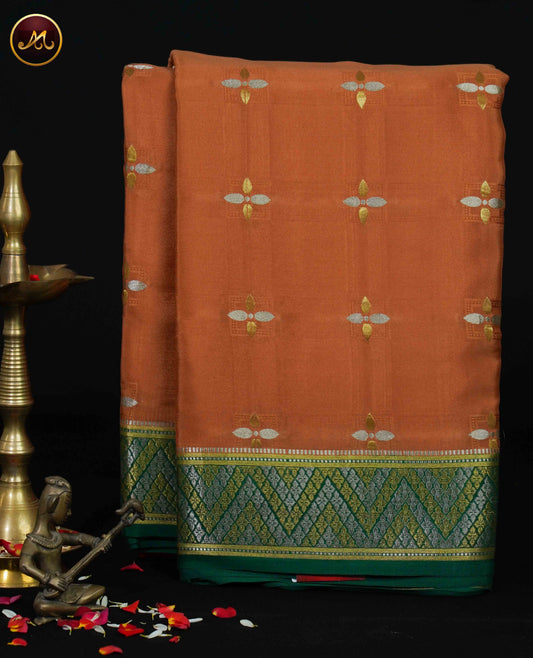 Mysore Crepe Silk saree with KSIC finish in Chikoo and Bottle Green combination with Diamond Butta and Rich  Pallu