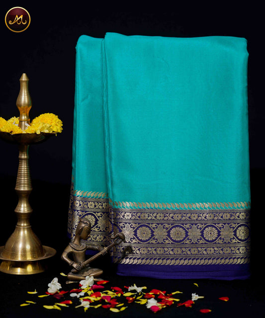 Mysore Crepe Silk saree with KSIC finish in Rama Green and Navy Blue combination with Gold Zari Border and Chit  Pallu