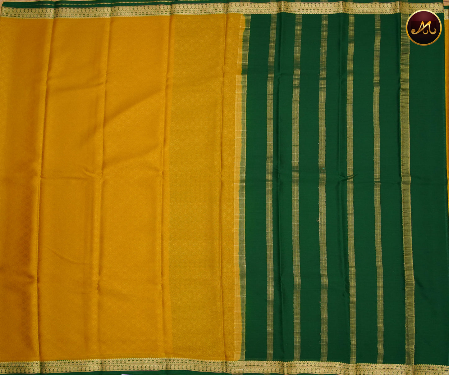 Mysore Crepe Silk saree with KSIC finish in Chutney Green  and Bottle Green combination with Gold Zari Border and Chit Pallu and Silk Emboss allover the body