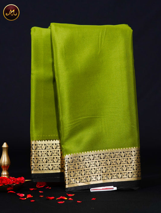 Mysore Crepe Silk saree with KSIC finish in Leaf Green  and Black combination with Gold Zari Border and Chit Pallu