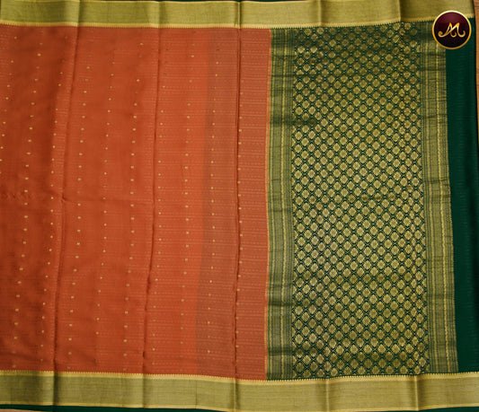 Mysore Crepe Silk saree with KSIC finish in Rare Gold  and Bottle Green combination with Silk Emboss allover the body and Grand Pallu