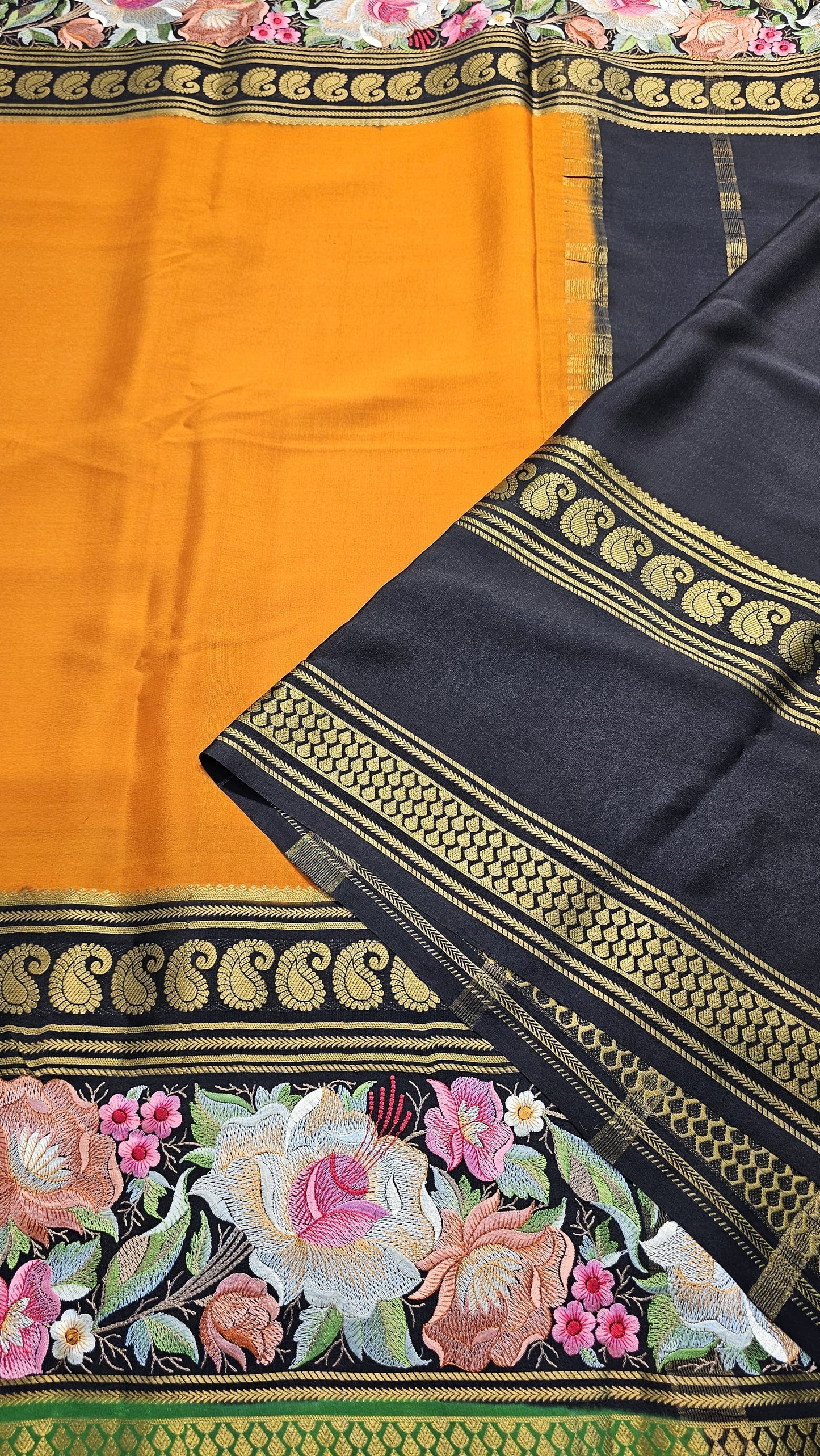 Mysore crepe silk saree with KSIC Finish in orange with black in embroidery pattern