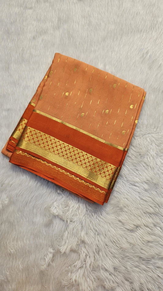 Mysore crepe silk saree with KSIC Finish in peach with orange in allover buttas pattern