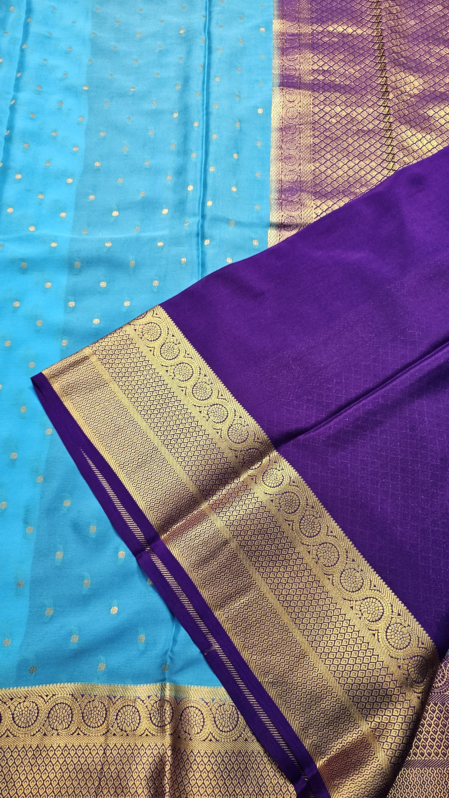 Mysore crepe silk saree with KSIC Finish in sky blue with purple in allover zari buttas pattern
