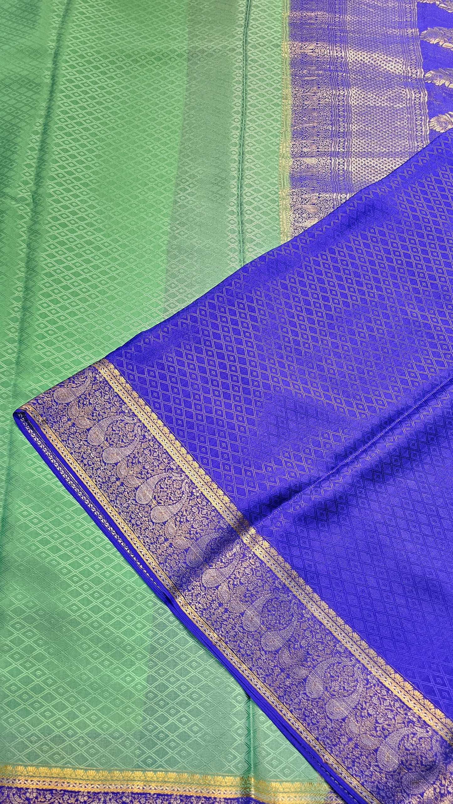 Mysore crepe silk saree with KSIC Finish in rama green with royal blue in mango motifis border