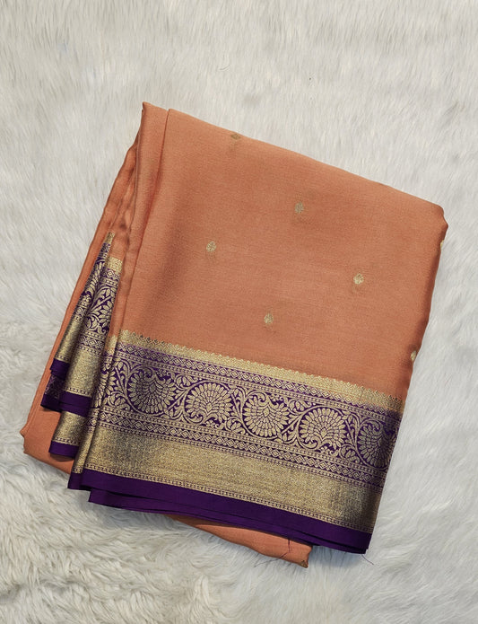 Mysore crepe silk saree with KSIC Finish in rust orange with purple in allover zari buttas pattern