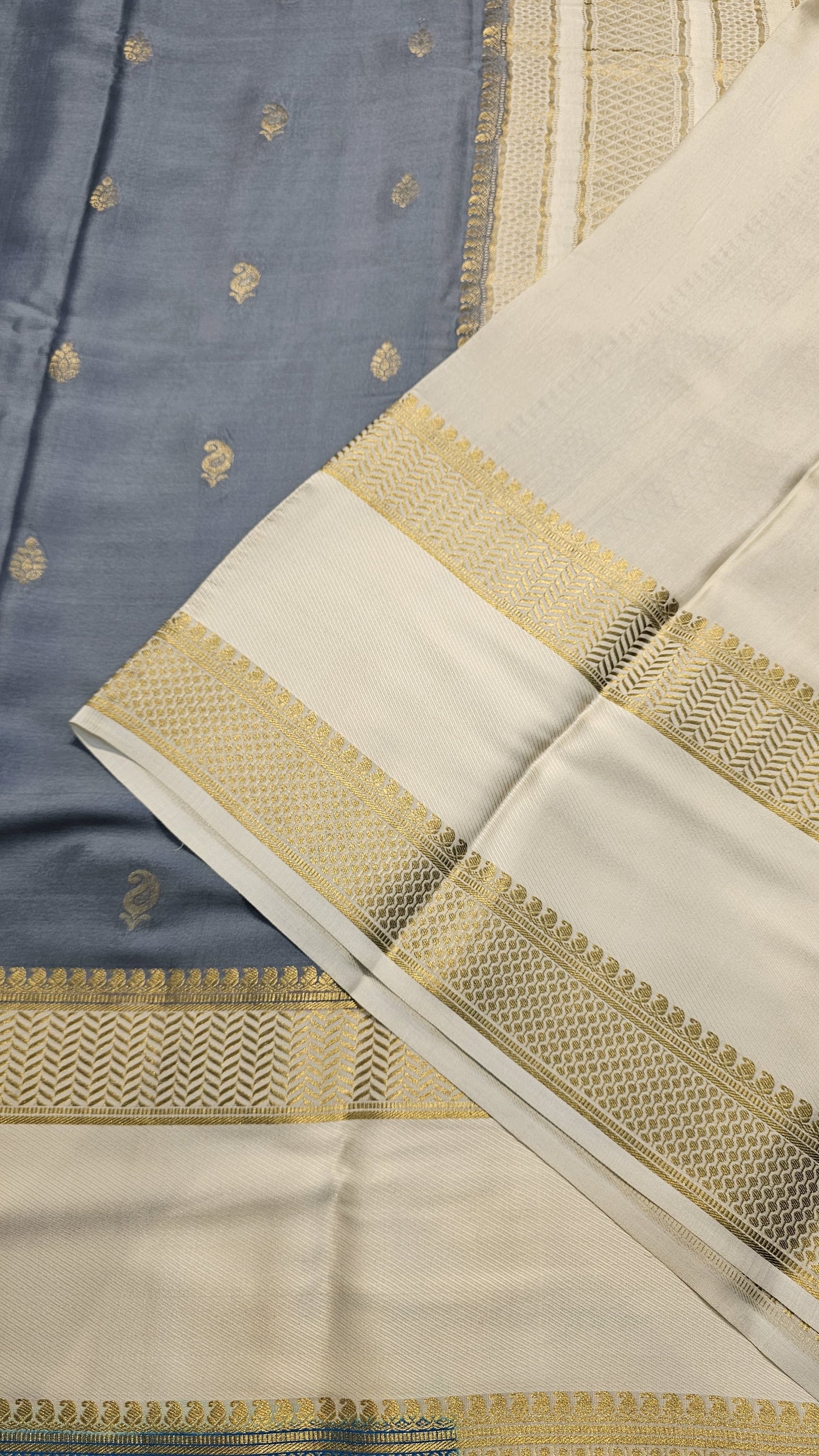 Mysore crepe silk saree with KSIC Finish in grey with half white in allover zari buttas pattern