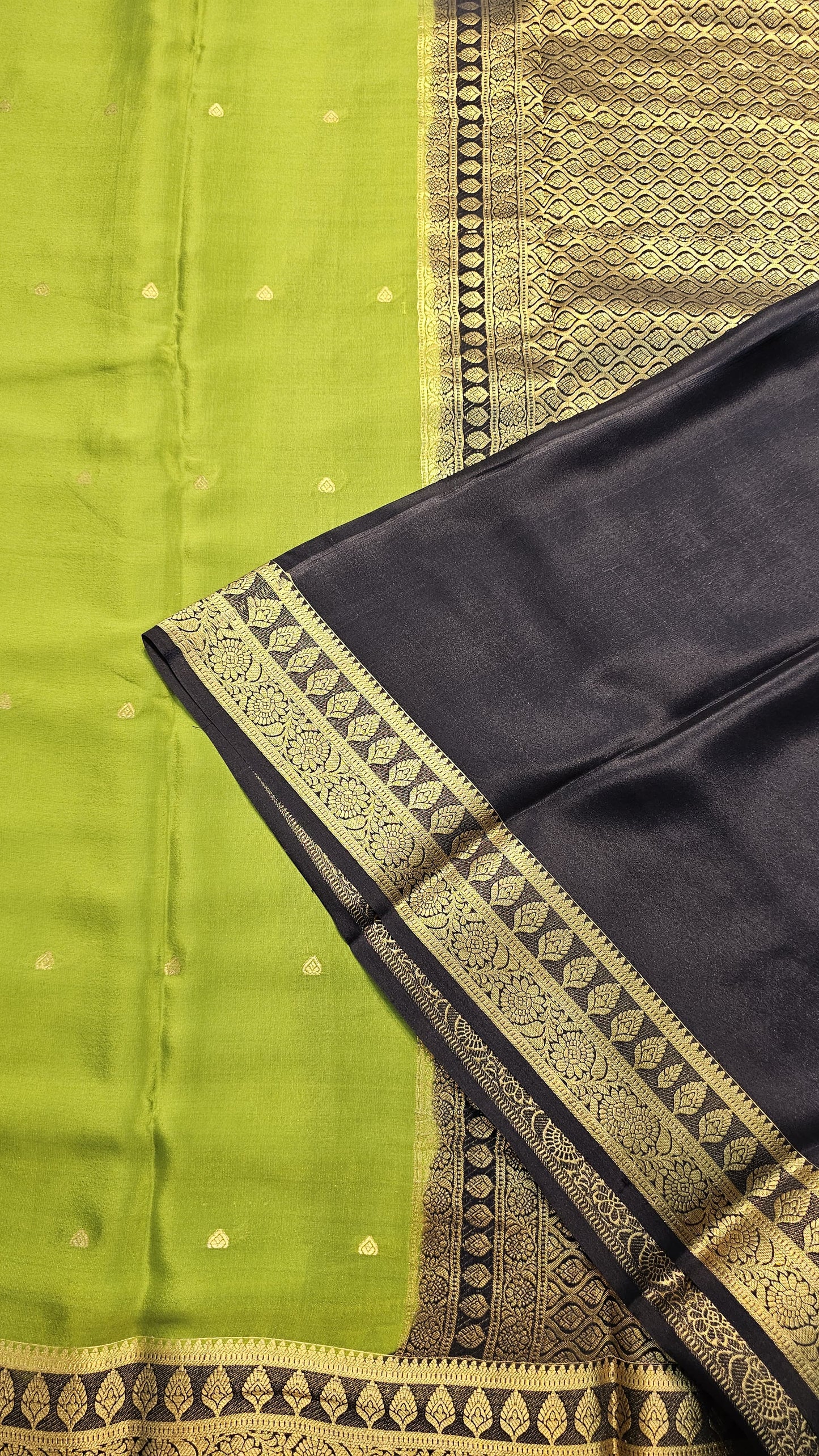 Mysore crepe silk saree with KSIC Finish in mehendi green with black in zari butta pattern