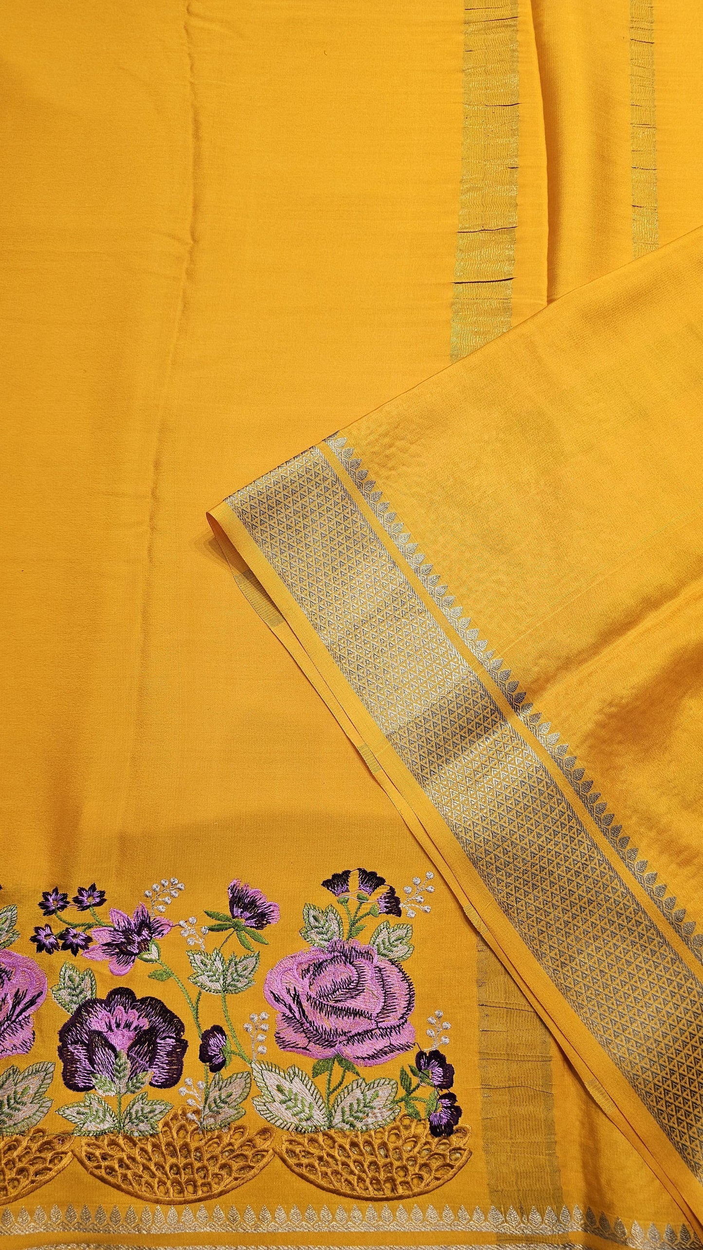 Mysore crepe silk saree with KSIC Finish in mango yellow self in one side cutwork pattern
