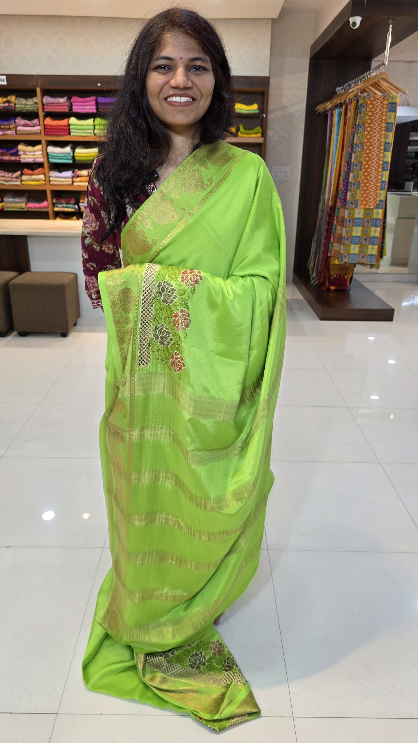 Mysore crepe silk saree with KSIC Finish in parrot green self in one side cutwork pattern