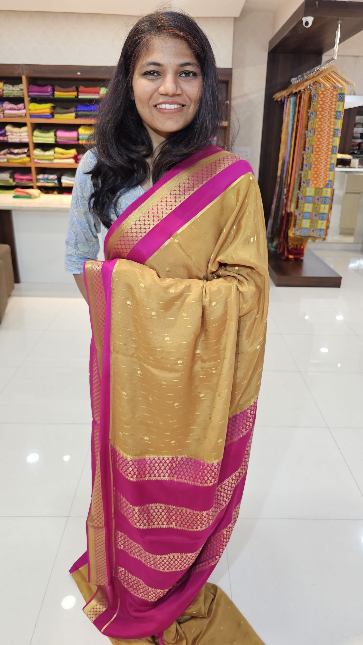 Mysore crepe silk saree with KSIC Finish in gold with rani pink in allover buttas pattern