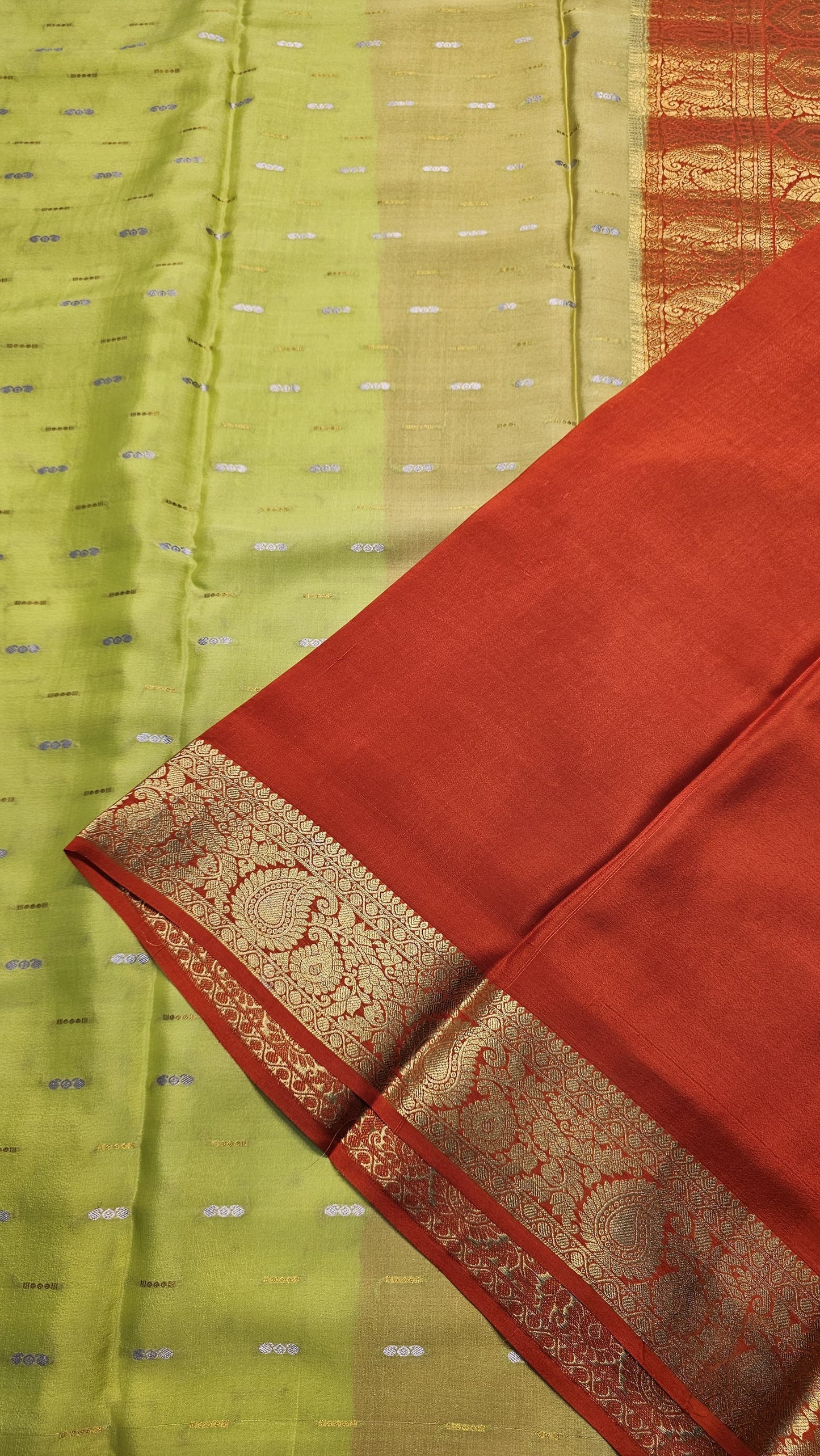 Mysore crepe silk saree with KSIC Finish in lemon green with orange in mango border pattern