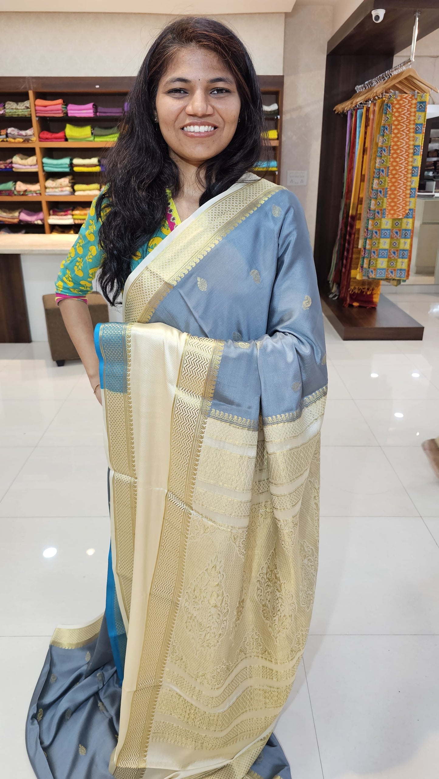 Mysore crepe silk saree with KSIC Finish in grey with half white in allover zari buttas pattern