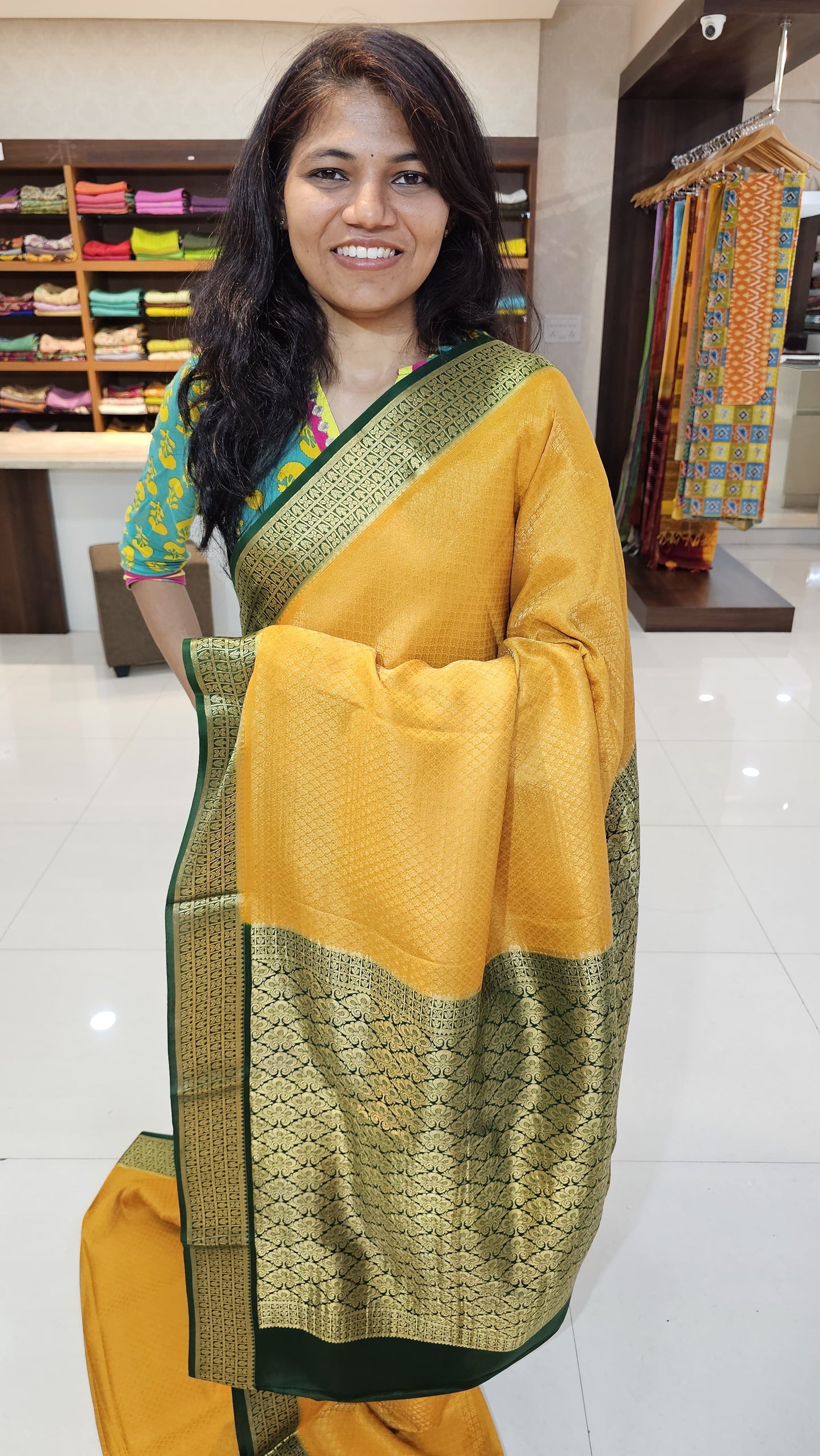 Mysore crepe silk saree with KSIC Finish in mango yellow, with green in brocade zari pattern