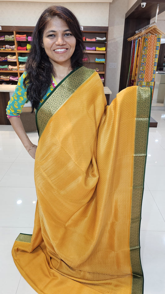 Mysore crepe silk saree with KSIC Finish in mango yellow, with green in brocade zari pattern
