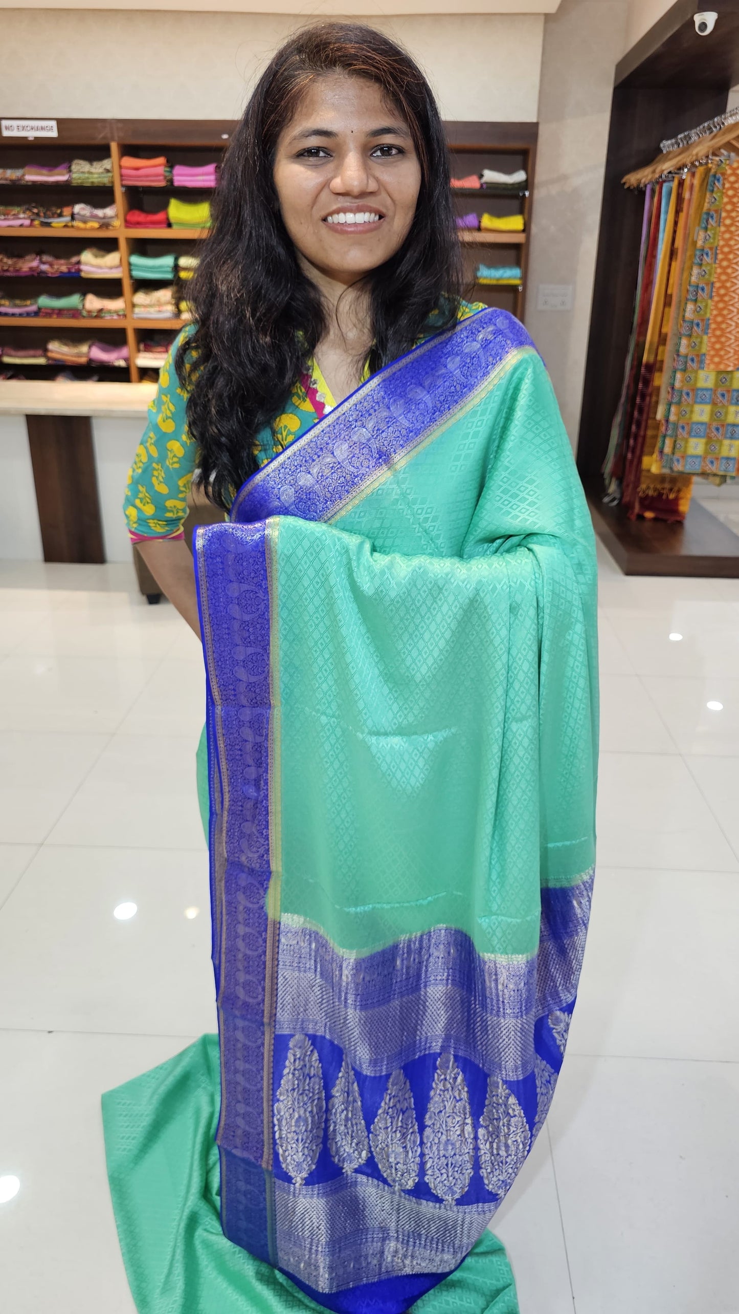 Mysore crepe silk saree with KSIC Finish in rama green with royal blue in mango motifis border