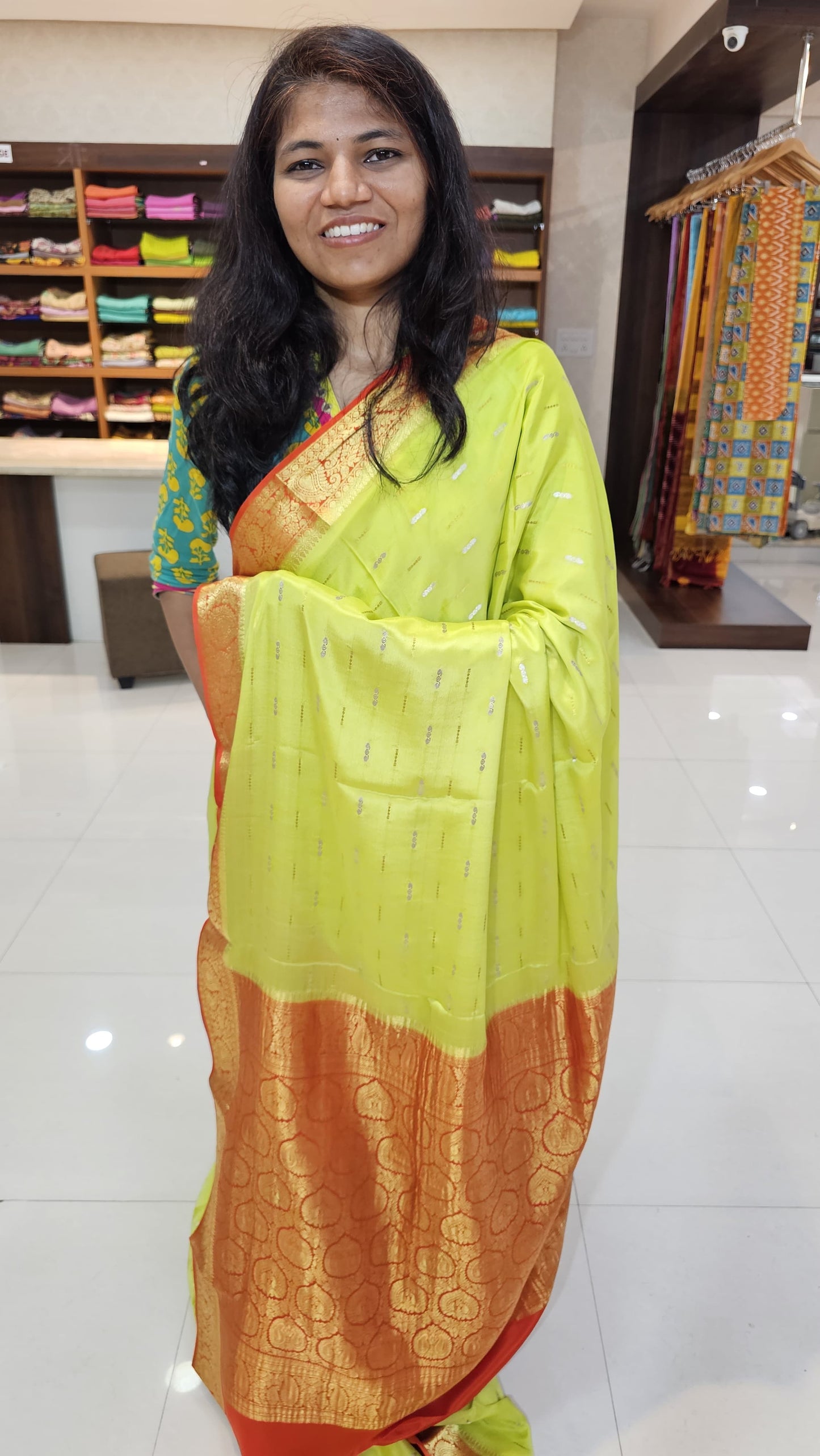 Mysore crepe silk saree with KSIC Finish in lemon green with orange in mango border pattern