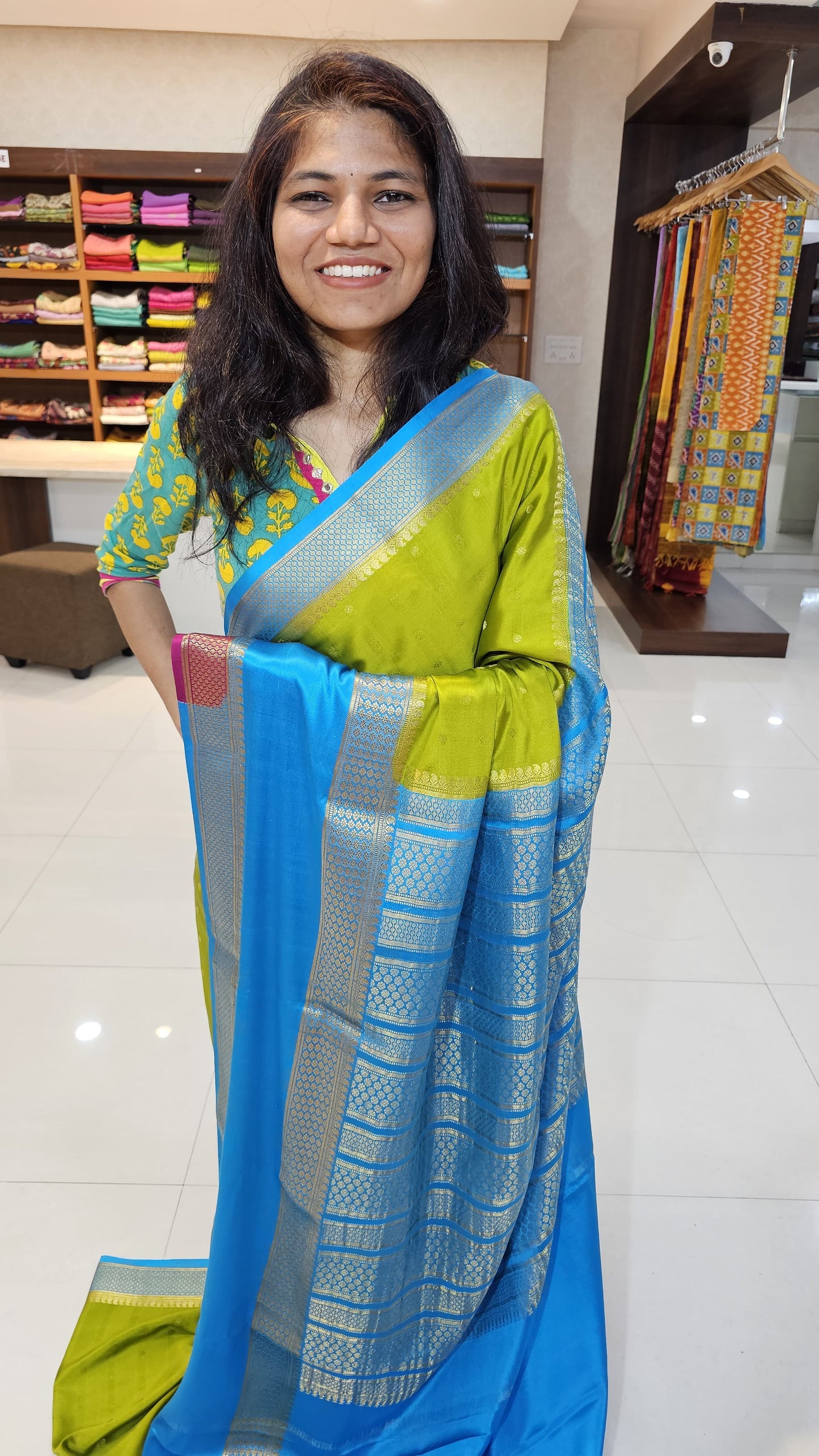 Mysore crepe silk saree with KSIC Finish in mehendi green with ananda blue in allover buttas pattern