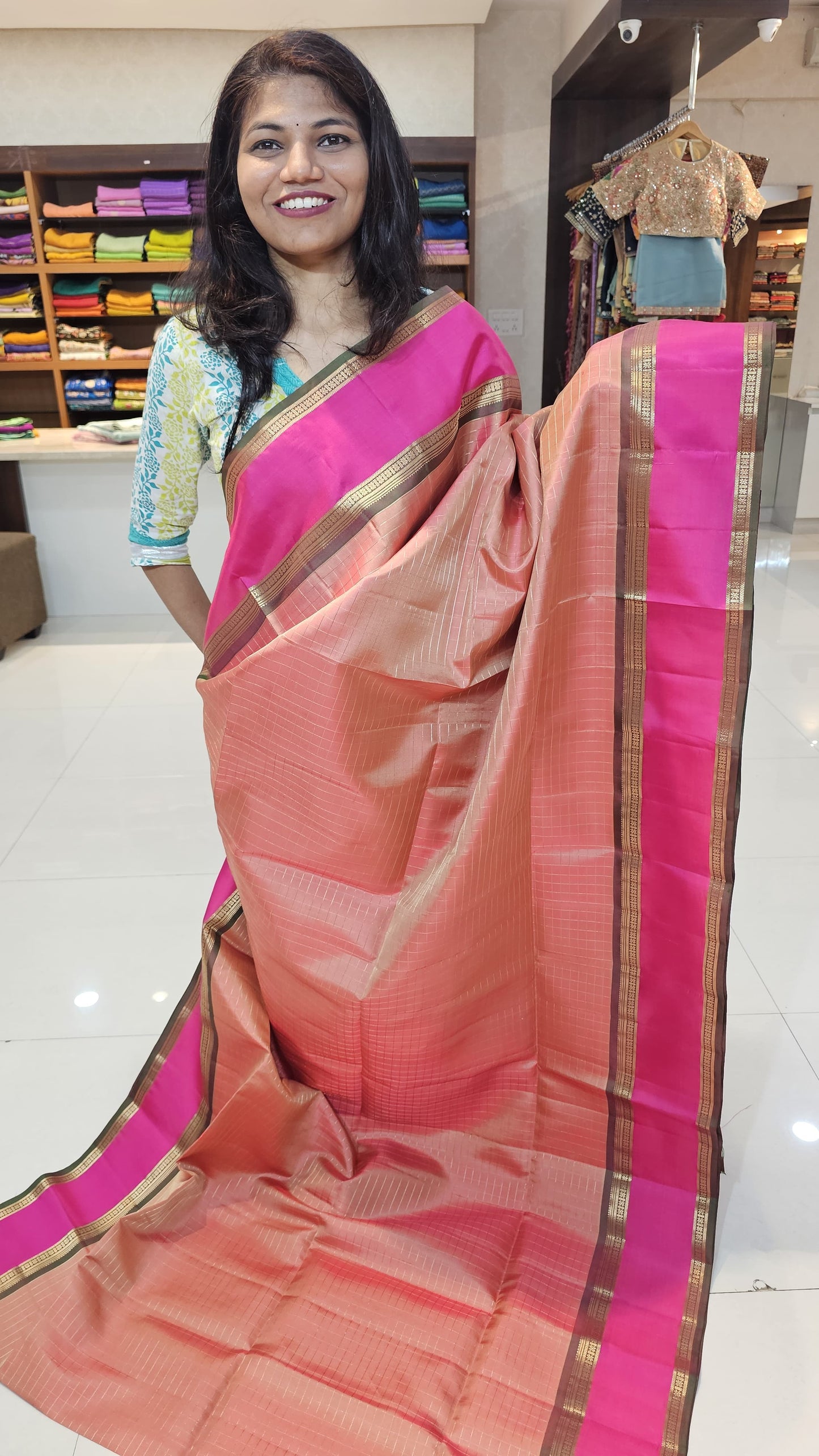 handloom kanchi soft silk saree in peach with rani pink in bentex border