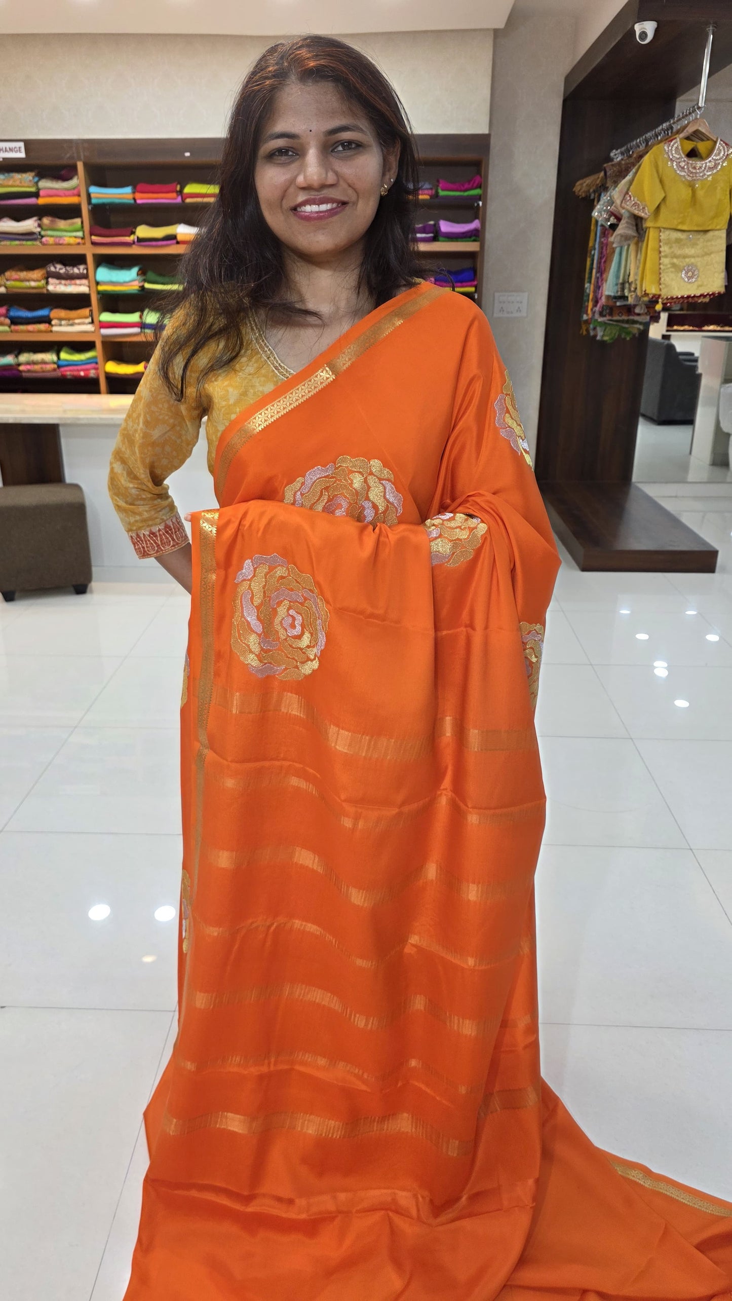 Mysore crepe silk in KSIC Finish in orange self rose butta saree