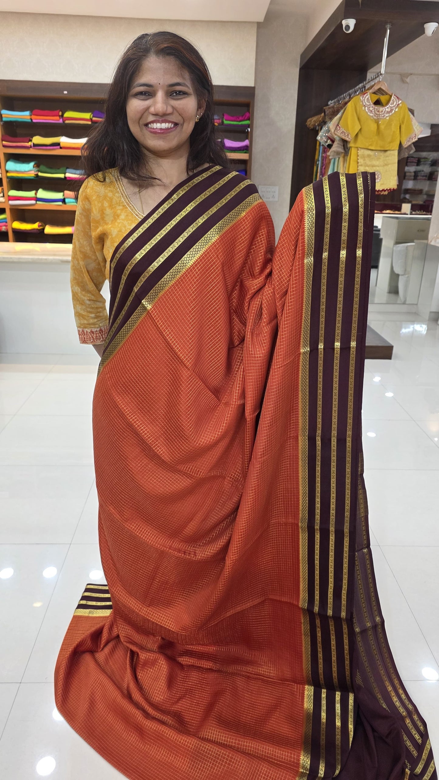 Mysore crepe silk sarees in KSIC finish in orange with brown checks pattern