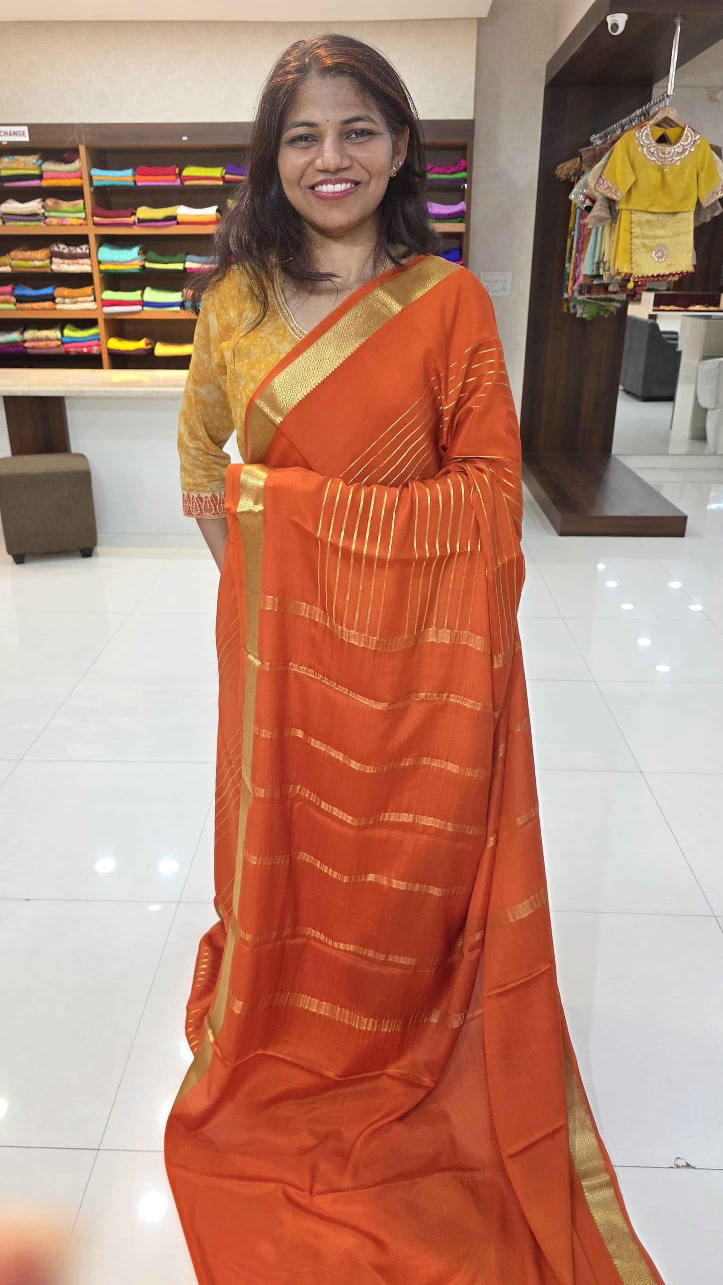 Mysore crepe silk sarees in KSIC Finish in orange self color lines pattern