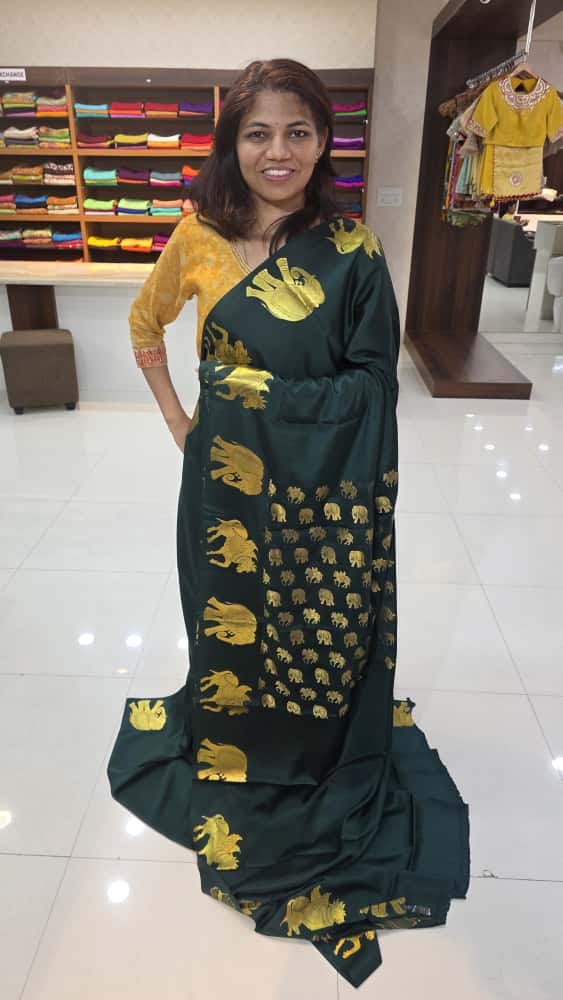 Mysore crepe silk saree with KSIC Finish in bottle green self color elephant border