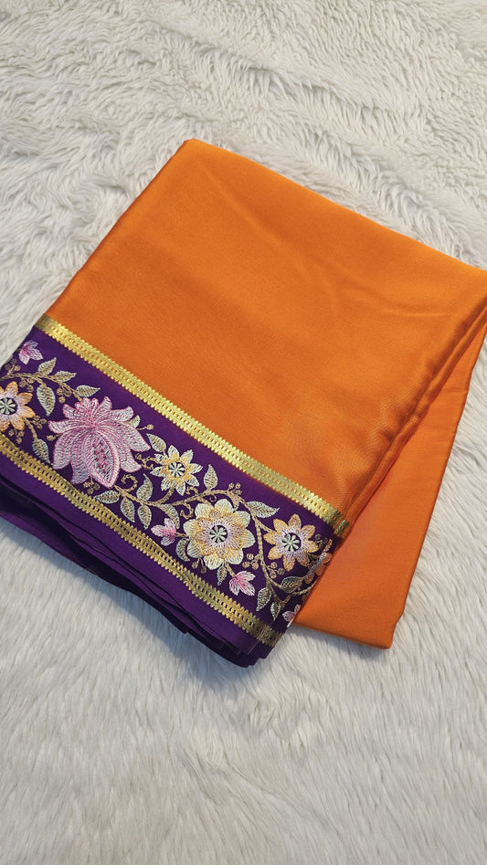 Mysore crepe silk saree in KSIC Finish in orange with purple 2side embroidery