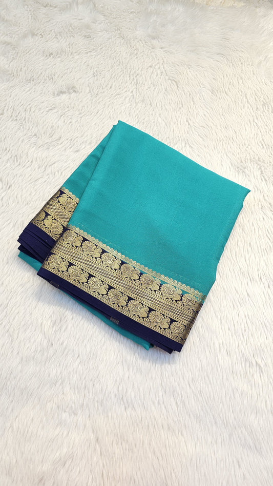 Mysore crepe silk saree with KSIC Finish in rama green with ink blue in peacock border