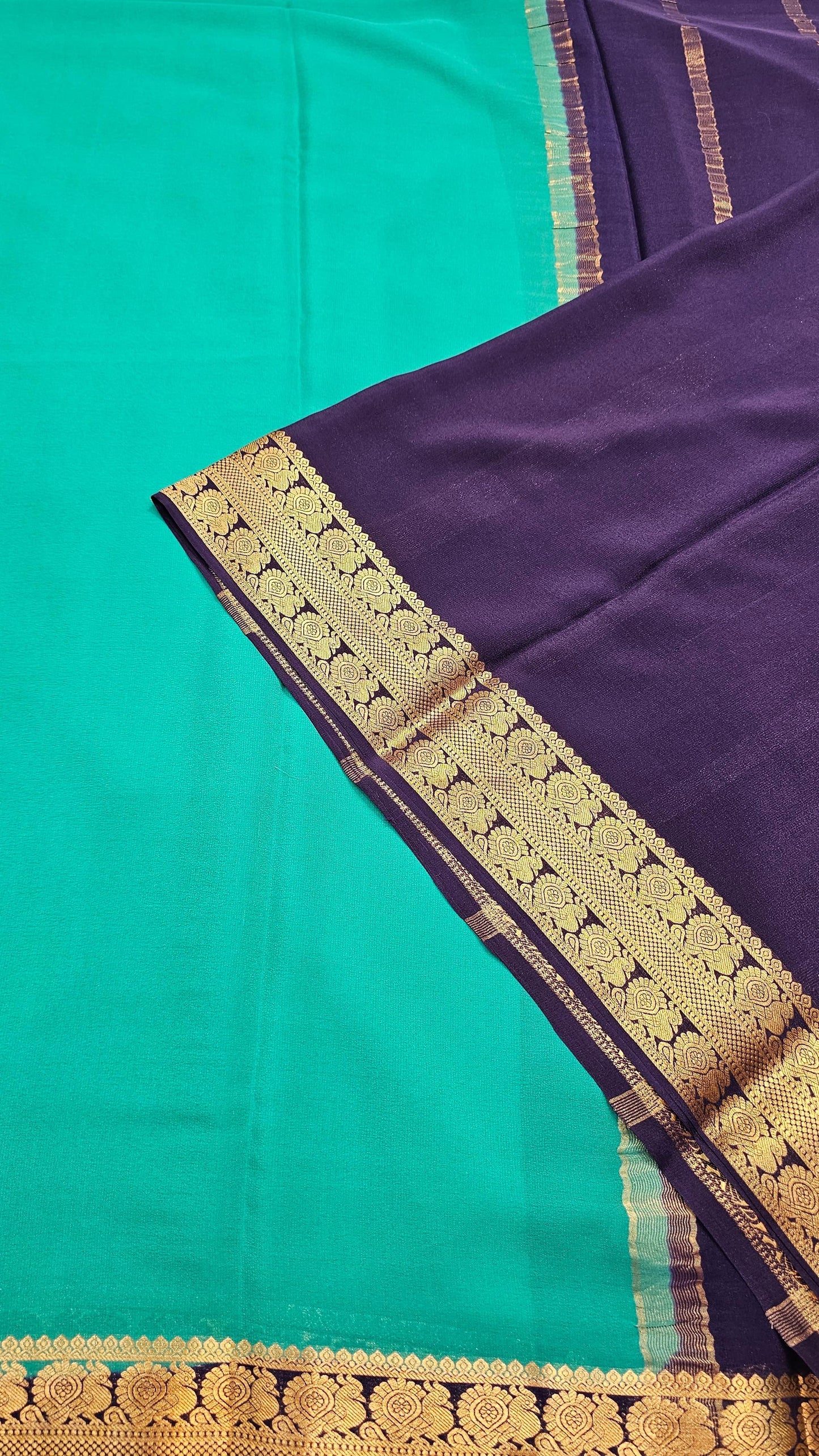 Mysore crepe silk saree with KSIC Finish in rama green with ink blue in peacock border