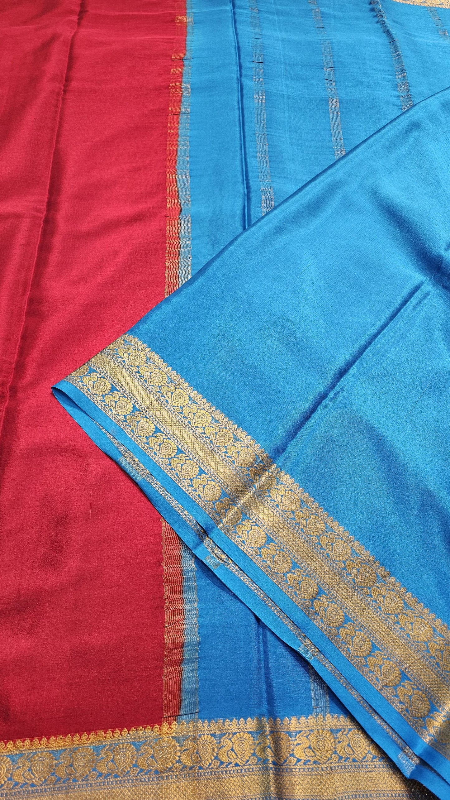 Mysore crepe silk saree with KSIC Finish in chilly red with ocean blue in peacock border