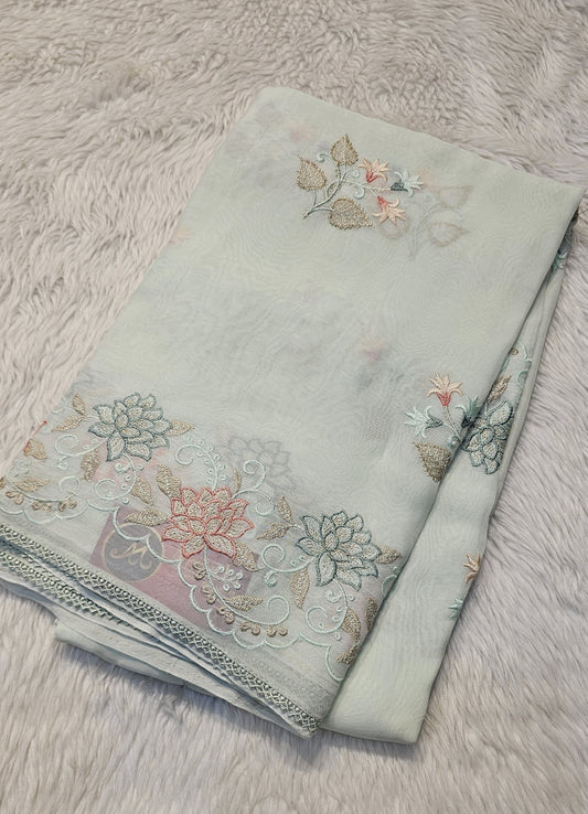 Semi organza fancy saree in light pista green self with allover embroidery work