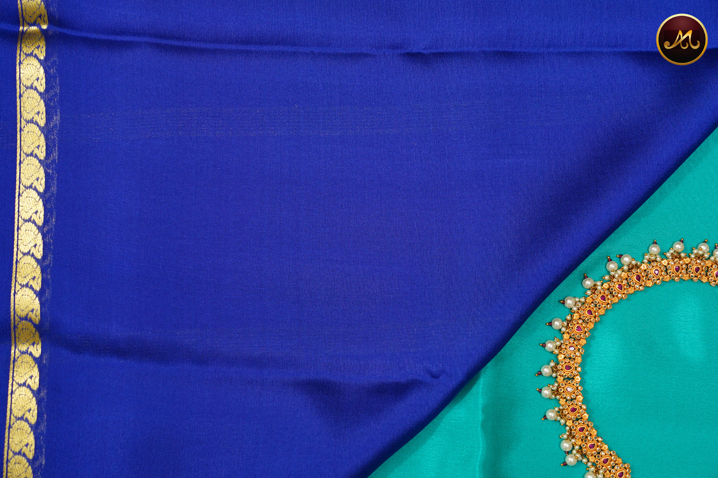 Mysore Crepe Silk saree with KSIC finish in Teal and KSIC Blue combination with Golden zari Bentex Mango Border