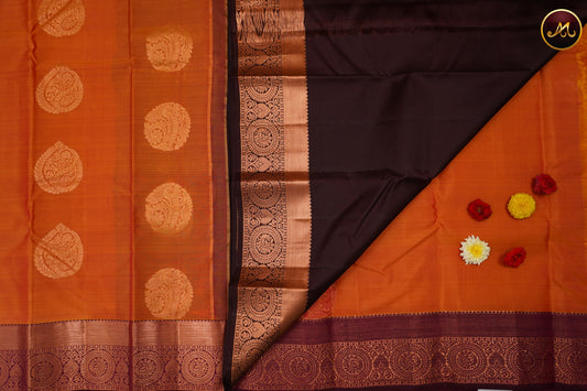 Kanchivaram Handloom Pure -Silk in Butta Pattern in Orange  And Brown combination with Copper Zari  Border