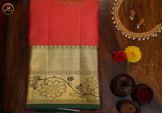 Kanchivaram Handloom Pure -Silk in Butta Pattern in Peach  And Green combination with Gold Zari  Border