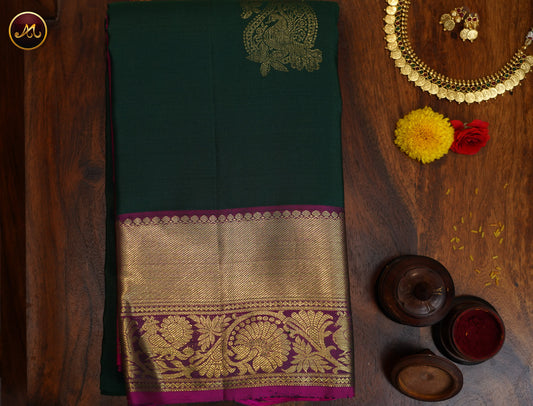 Kanchivaram Handloom Pure Silk in Butta Pattern in Bottle green  And rani Pink combination with Gold Zari  Border and Rich Pallu
