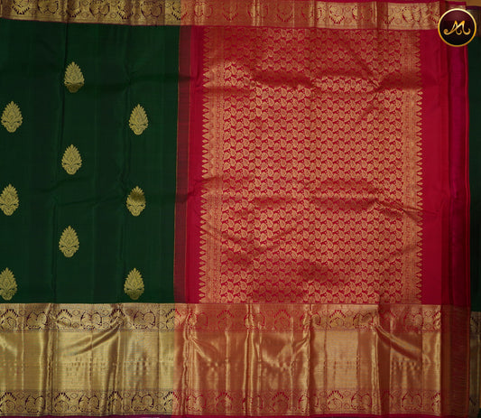 Kanchivaram Handloom Pure Silk in Butta Pattern in Bottle green  And Rani Pink combination with Gold Zari Long  Border and Rich Pallu