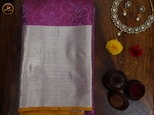 Kanchivaram Handloom Pure Silk in Butta Pattern in Purple  And rani Pink combination with Gold Zari turning   Border and Rich Pallu