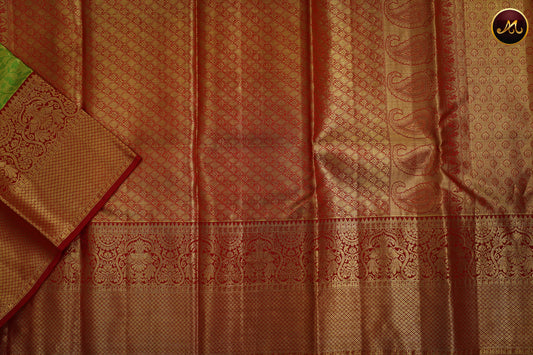 Kanchivaram Handloom Pure Silk in Tissue Emboss Pattern in Parrot green  And Red combination with Gold Zari  Border and Rich Pallu