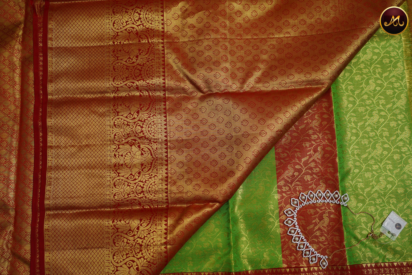 Kanchivaram Handloom Pure Silk in Tissue Emboss Pattern in Parrot green  And Red combination with Gold Zari  Border and Rich Pallu