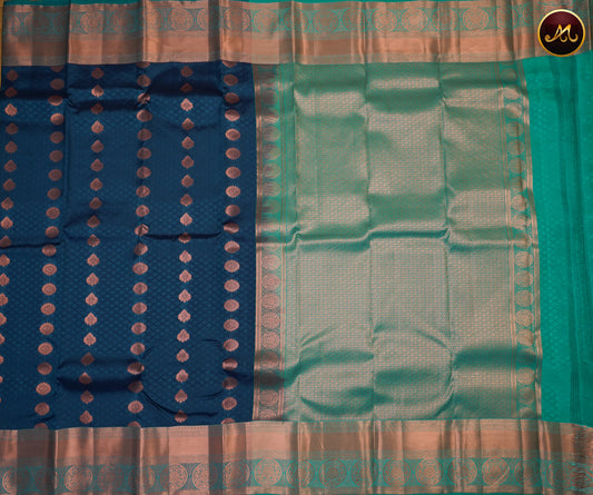 Kanchipuram Semi-Silk Sarees in Peacock Green with Rama Green Combination with Emboss work allover the Body  and copper zari border and Rich Pallu