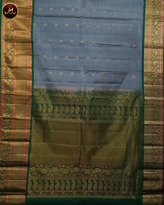 Pure Kanchi Silk Saree with body in Grey colour and Buttas allover and Bottle Green Long Border