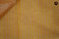 Gold tissue saree in with orange bandini prints and goldzari border