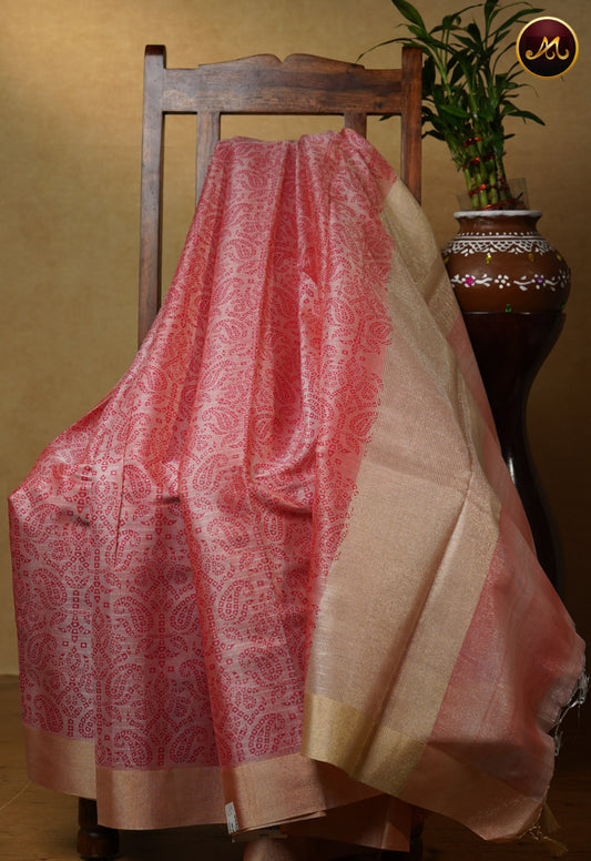 Gold tissue saree in with baby pink bandini prints and goldzari border