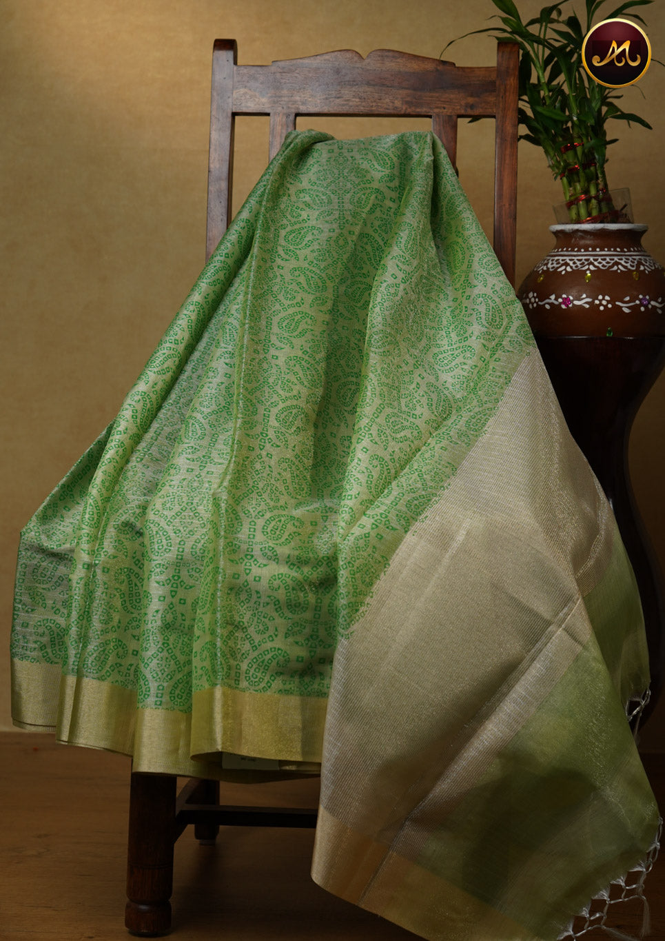 Gold tissue saree in with parrot green bandini prints and goldzari border