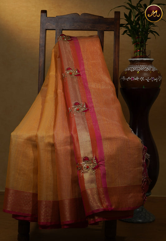 Gold tissue saree with plain gold body and Ganga jamuna(orange and pink) border with work butta